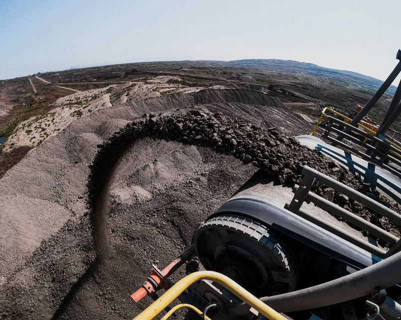 IRH mining machinery working on rugged terrain for resource extraction