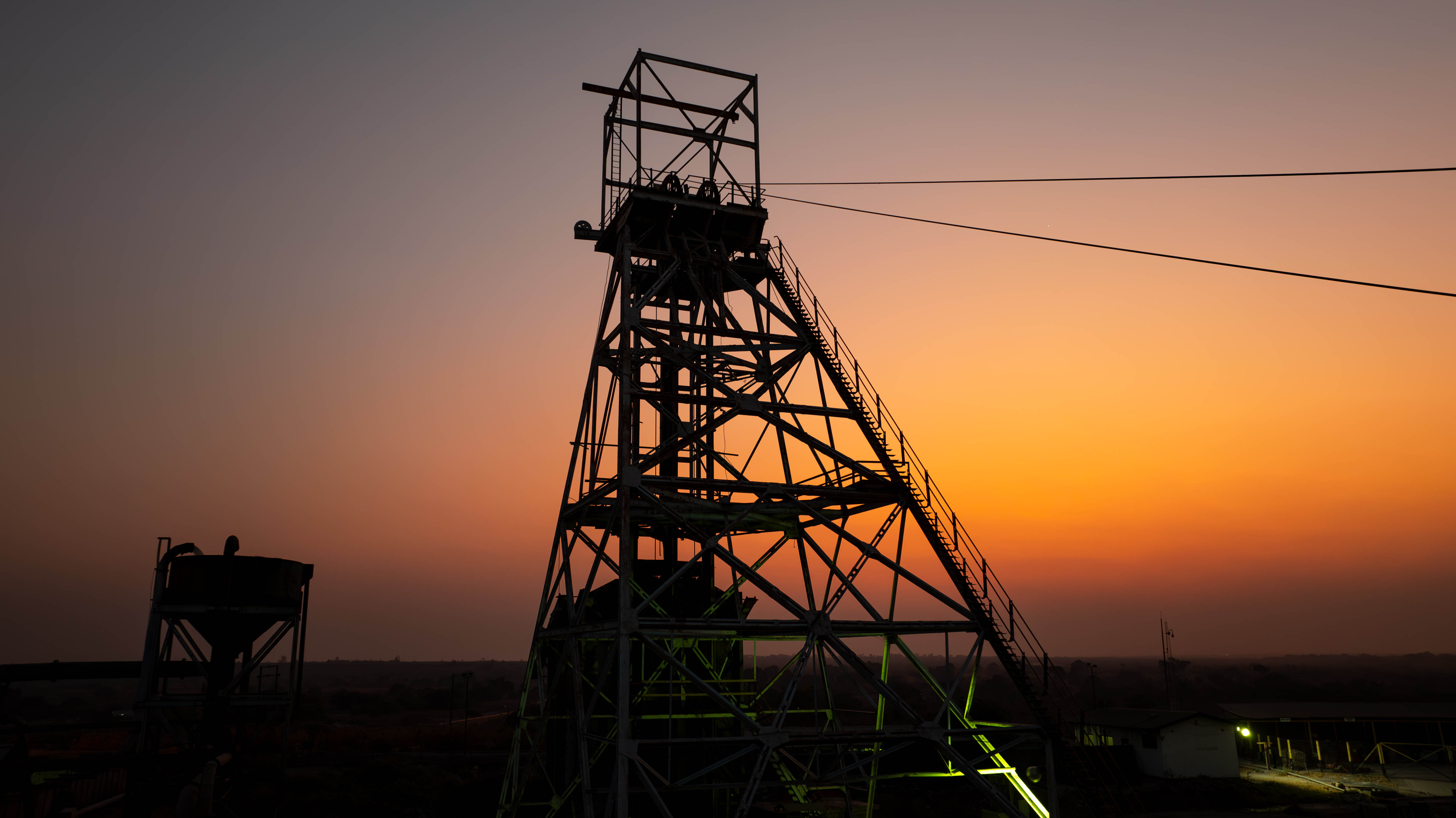 Mining shaft silhouette during sunrise at International Resources Holding’s Mopani Copper Mines